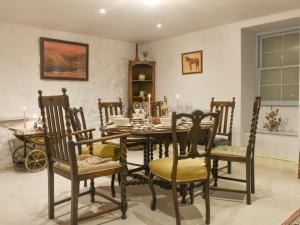 a dining room with a table and chairs at Church View in Skipton
