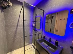 a bathroom with a sink and a mirror at CityZen in Casablanca +11 photos