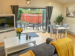 a living room with a couch and a table at Woodside Retreat, Number 37 in Worthington