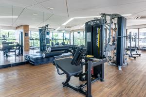 a gym with treadmills and machines in a building at BHS Flat a beira mar 2105 in Recife