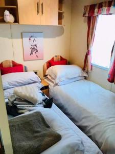 Ένα ή περισσότερα κρεβάτια σε δωμάτιο στο Seaside holidays the grange