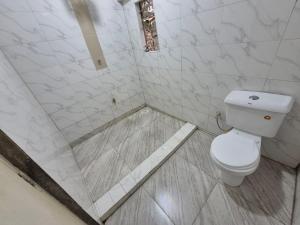 Koupelna v ubytování CFC Family Care Home + 26 fotografií