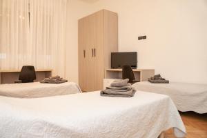 Postel nebo postele na pokoji v ubytování Roiano Cinque