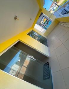 an overhead view of a kitchen with an open window at Iane Raquel Bezerra Barbosa in Tamandaré