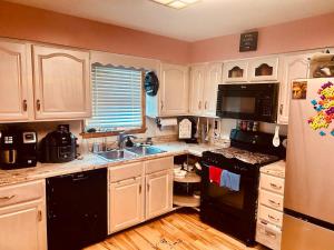 Kuchyň nebo kuchyňský kout v ubytování Del La Rose