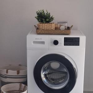 a washing machine with a basket on top of it at Rodini Home Ylia - Rhodes in Rhodes Town