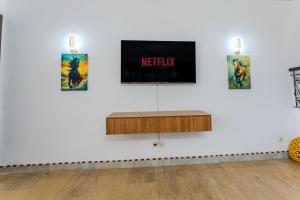 a room with a tv on a white wall at MVIEW Villas in Marrakech