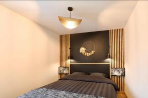 Postel nebo postele na pokoji v ubytování La Ptite Maison Ardennaise