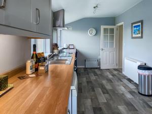 a kitchen with a sink and a wooden counter top at Six The Square - Uk48869 in Belford
