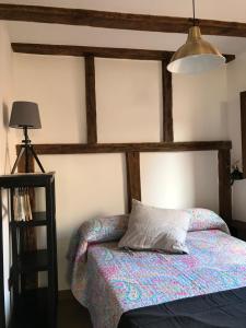 a bedroom with a bed with a pillow on it at estudio judería in Sigüenza