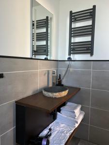 a bathroom with a sink and a mirror and towels at Well-being in Eifel in Nettersheim +15 photos