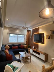 Μια τηλεόραση ή/και κέντρο ψυχαγωγίας στο 2 bedroom - Cinema - Free Parking - Pool - Gym - Netflix