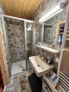 a bathroom with a sink and a shower at Landgasthof Marhube in Baldramsdorf