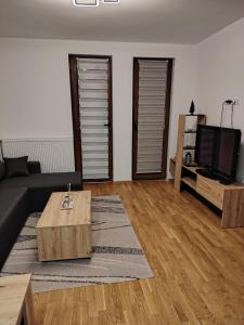 a living room with a couch and a coffee table at Stela Divcinova in Divčibare