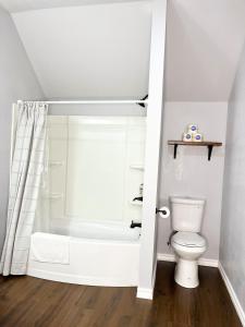 a bathroom with a shower and a toilet at My house your house in Fort Smith +28 photos