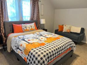 a bedroom with a bed and a couch at My house your house in Fort Smith