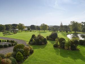 an aerial view of a park with a pond at Moorhens in Herstmonceux