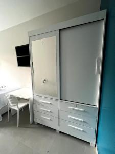 Μια τηλεόραση ή/και κέντρο ψυχαγωγίας στο Conforto e silêncio no coração de BH