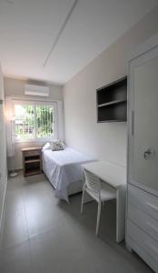 Μια τηλεόραση ή/και κέντρο ψυχαγωγίας στο 4 quartos Conforto e silêncio no coração de BH +22 φωτογραφίες