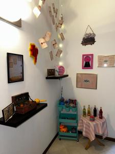 a room with a table and a wall with cards at La casa magica in Cuggiono +7 photos