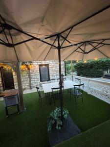 a patio with a table and chairs under a tent at 5 BR 4 Bath Dutch Cottage 3 ml from Buffalo Trace in Frankfort