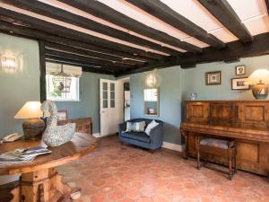 a living room with a table and a couch at Cravens Manor in Sotherton