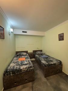 a room with two beds in a room at Hostel VOYAGE in Batumi +57 photos