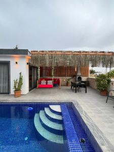 a villa with a swimming pool and a patio at Villa karya in Kas +14 photos