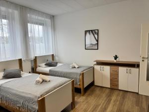 Postel nebo postele na pokoji v ubytování Moderne Ferienwohnungen - Service wie im Hotel