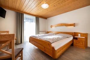 Ένα ή περισσότερα κρεβάτια σε δωμάτιο στο Haus Meneweger