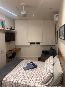 En eller flere senge i et værelse på Loft Copacabana