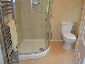 a bathroom with a shower and a toilet at Oaklands in Ambleside +3 photos
