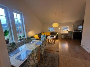 a living room with a couch and a table at Bagargården 8 in Åre