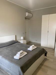 Ένα ή περισσότερα κρεβάτια σε δωμάτιο στο SUPREME Rooms