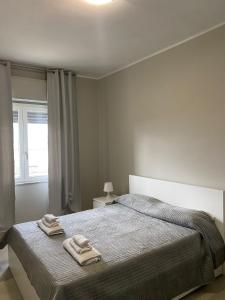 Ένα ή περισσότερα κρεβάτια σε δωμάτιο στο SUPREME Rooms