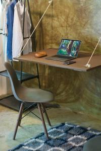 a desk with a laptop and a chair on it at Nanabi in Brisas de Zicatela +1 photo