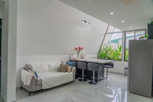 a living room with a chair and a table at Gival Paradise in Fortuna