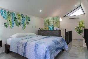 a bedroom with a blue and white bed and a window at Gival Paradise in Fortuna +44 photos