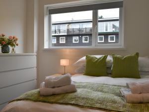 a bedroom with a bed with a window at Bowness Apartment - Uk11016 in Bowness-on-Windermere