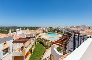 an aerial view of a villa with a swimming pool at NAU Salema Beach Village in Salema
