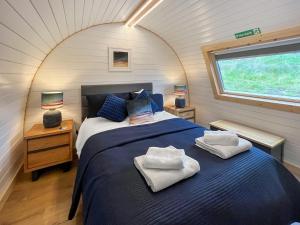 a bedroom with a bed in a tiny house at Totaig - Uk50717 in Kirkton