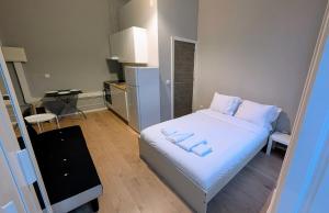 En eller flere senge i et værelse på Riko Guest House 2