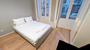 En eller flere senge i et værelse på Riko Guest House 2 + 3 billeder