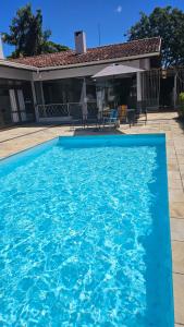 Bazén v ubytování Hospedagem Jardim Social - O seu lar longe de casa nebo v jeho okolí