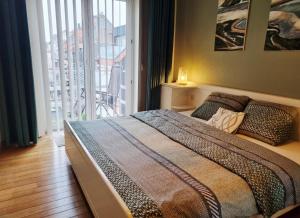 Ένα ή περισσότερα κρεβάτια σε δωμάτιο στο Ruim 4-persoonsappartement +20 φωτογραφίες