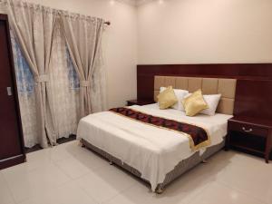 Ένα ή περισσότερα κρεβάτια σε δωμάτιο στο شقق أجمل الليالي للشقق المخدومة Ajmal Liyali Serviced Apartments +10 φωτογραφίες