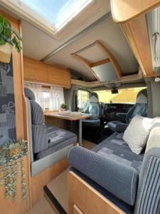 an interior view of an rv with a table and chairs at Alojamiento dondequiera I in Breña Baja