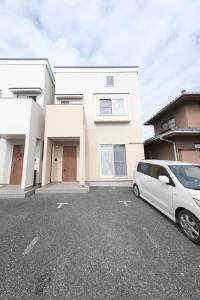 a white van parked in front of a house at ベル高崎 in Takasaki