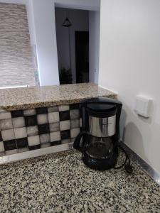 a blender sitting on a counter in a room at Bizerte appartement in Bizerte