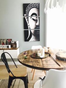 a dining room with a table and a picture of a woman at Cuco in Requena
